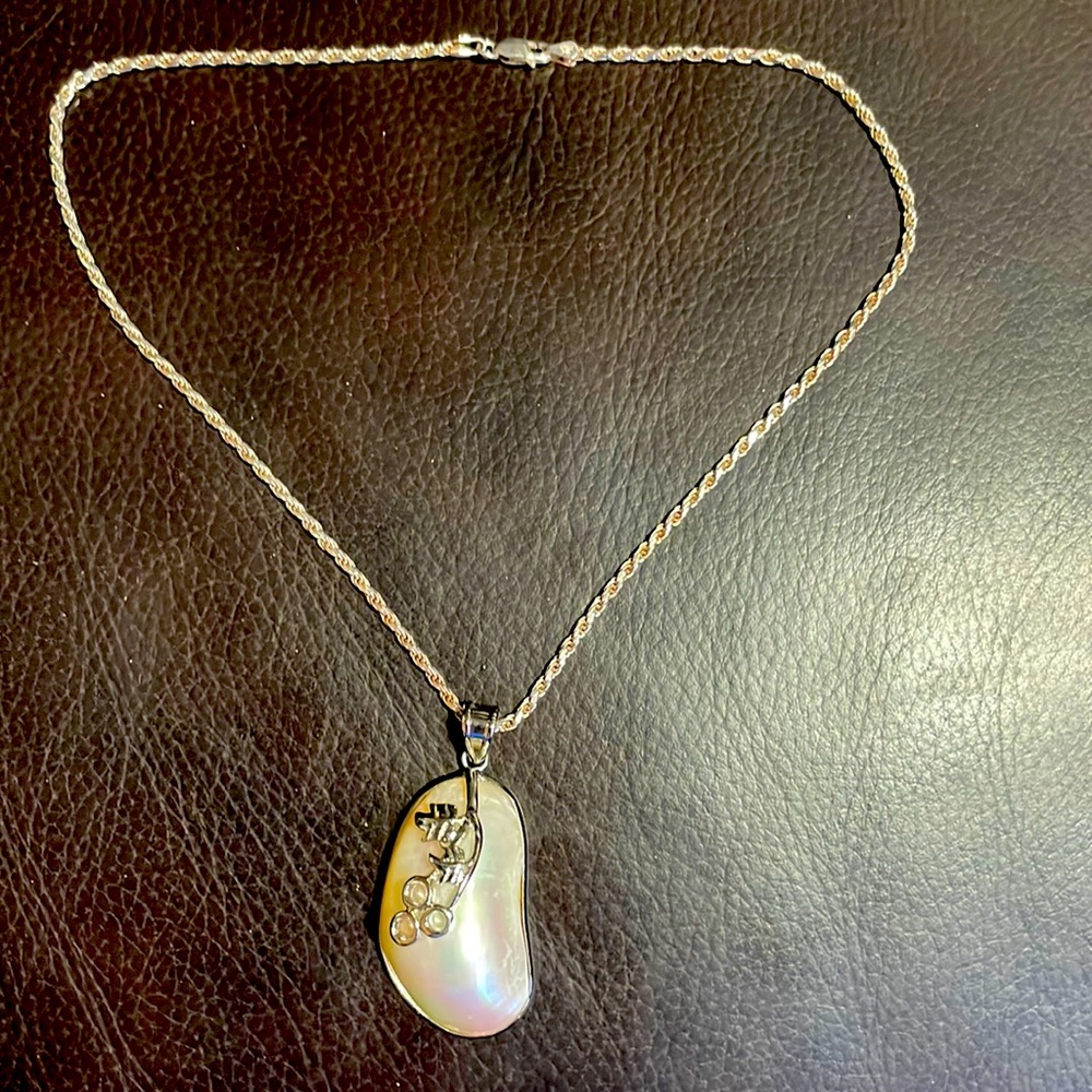 Sterling Silver Necklace with a Blister Mother of Pearl Pendant.